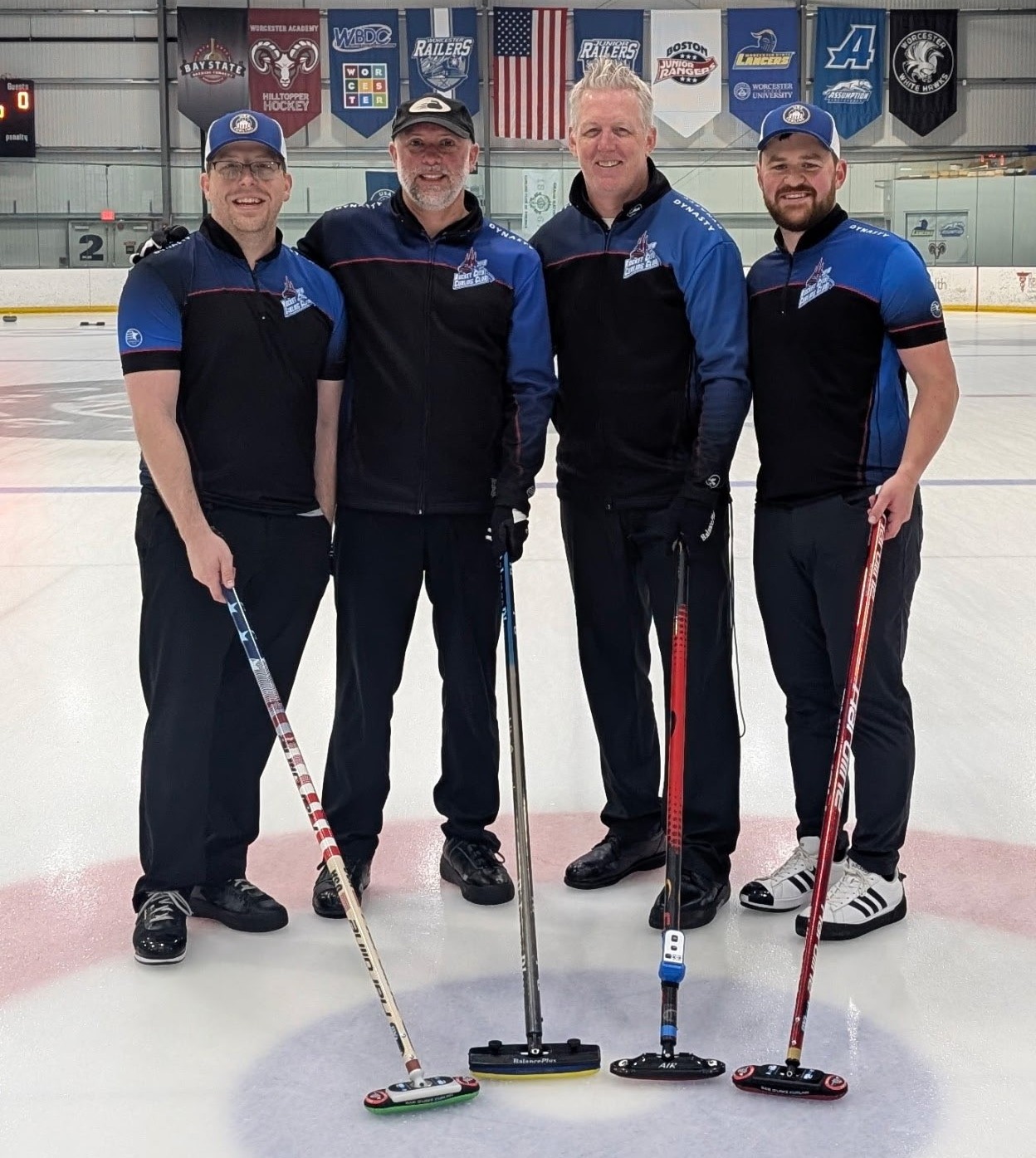May be an image of 4 people, people playing hockey, people skating and text