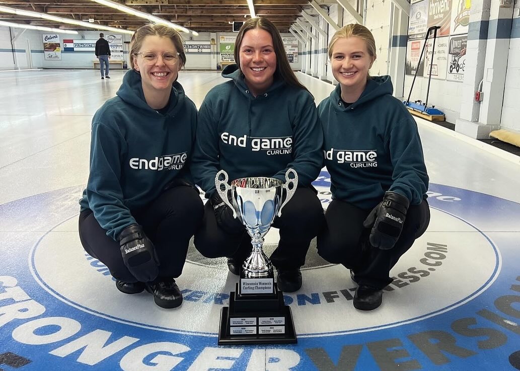 May be an image of 4 people, people playing hockey, people skating and text