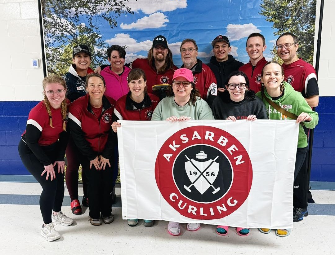 May be an image of 11 people, people playing hockey and text